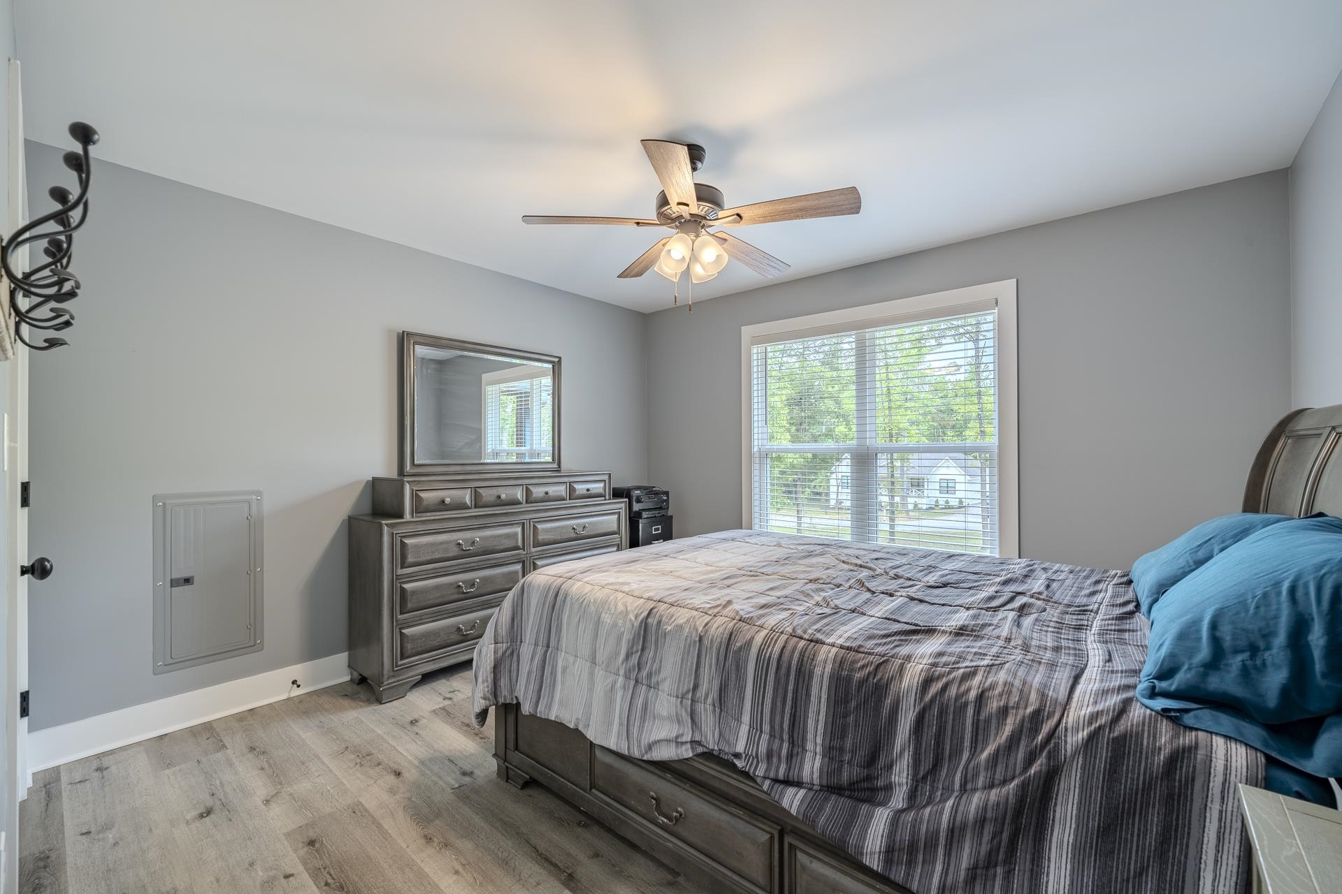 315 Timber Ridge Drive Counce, TN 38326 - Photo 17 of 40 a bedroom with a bed and a chandelier