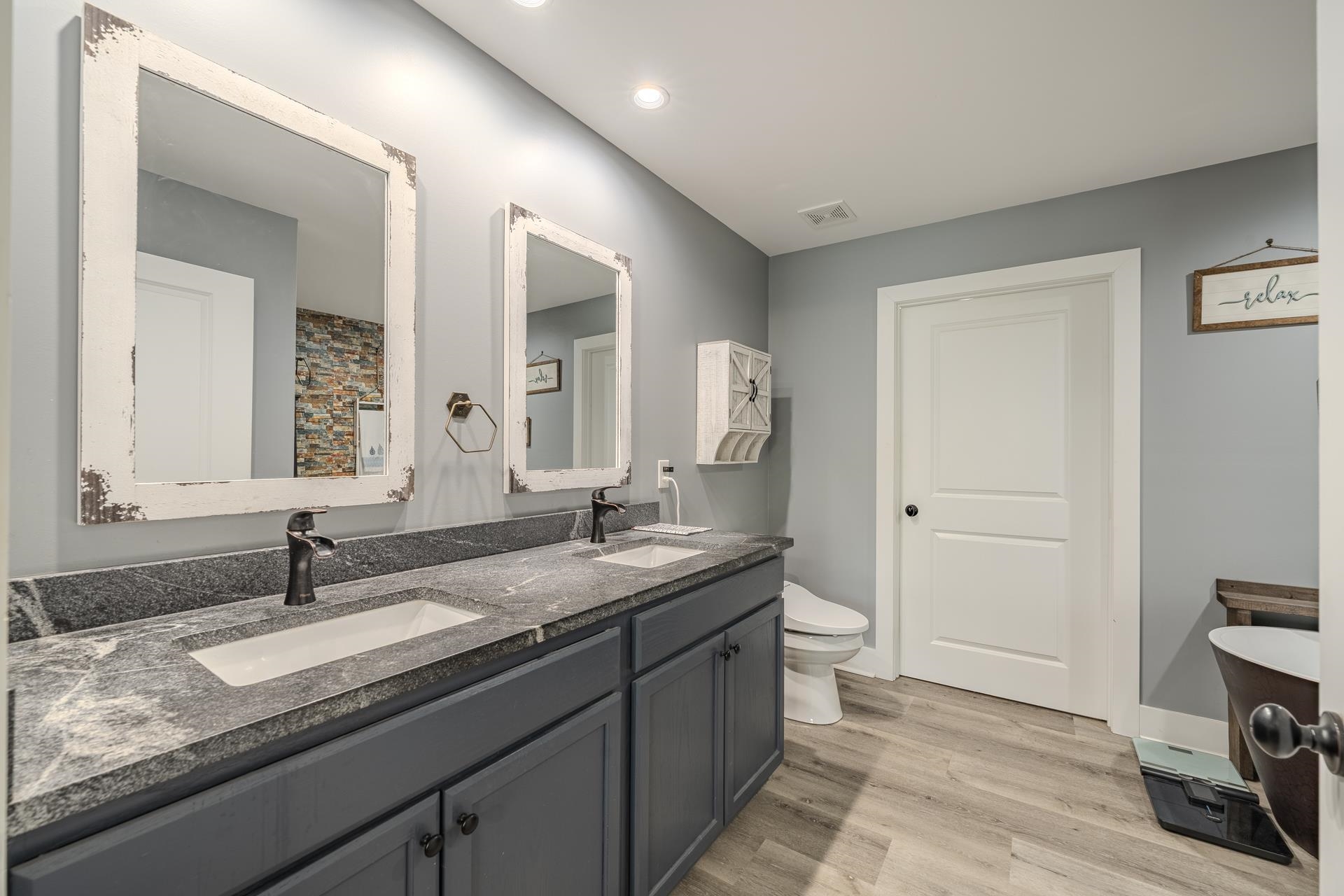 315 Timber Ridge Drive Counce, TN 38326 - Photo 20 of 40 a bathroom with a granite countertop sink and a mirror