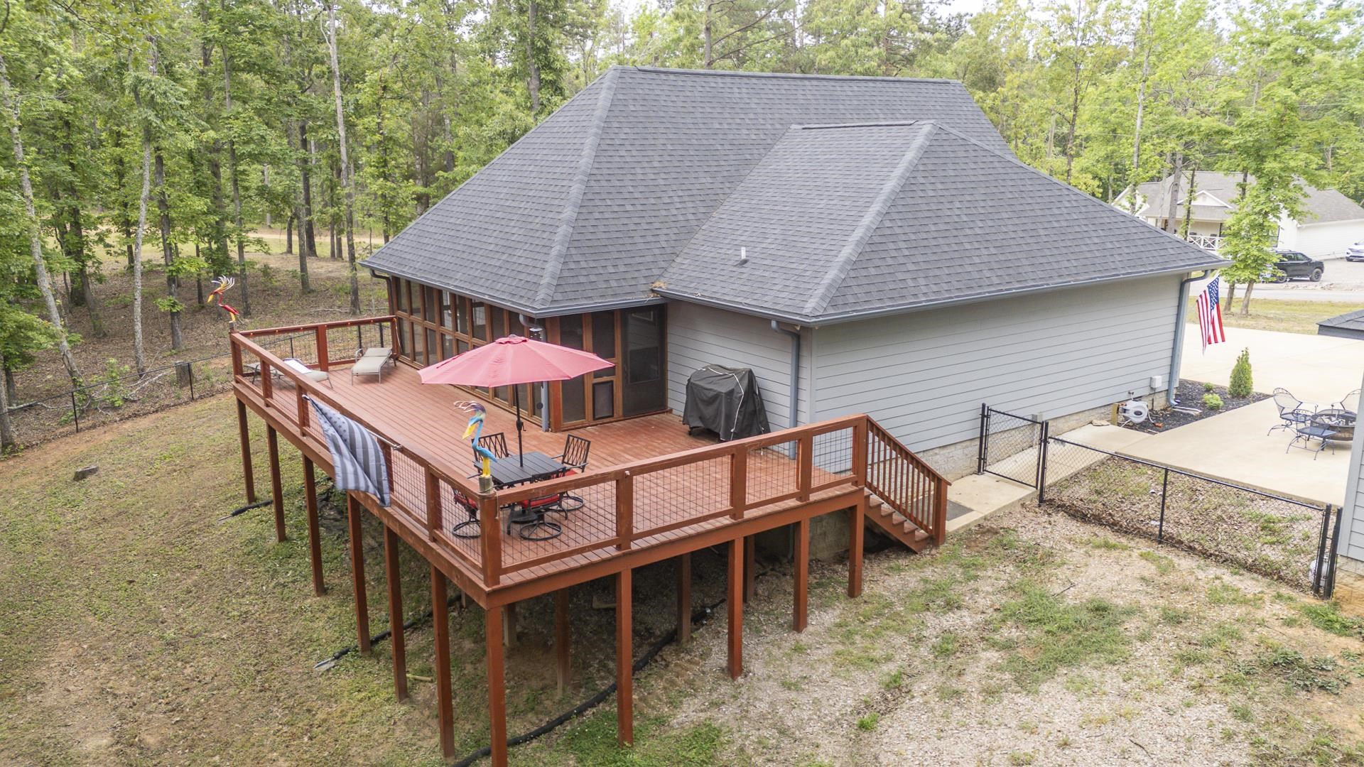 315 Timber Ridge Drive Counce, TN 38326 - Photo 24 of 40 a roof deck with a table and chairs