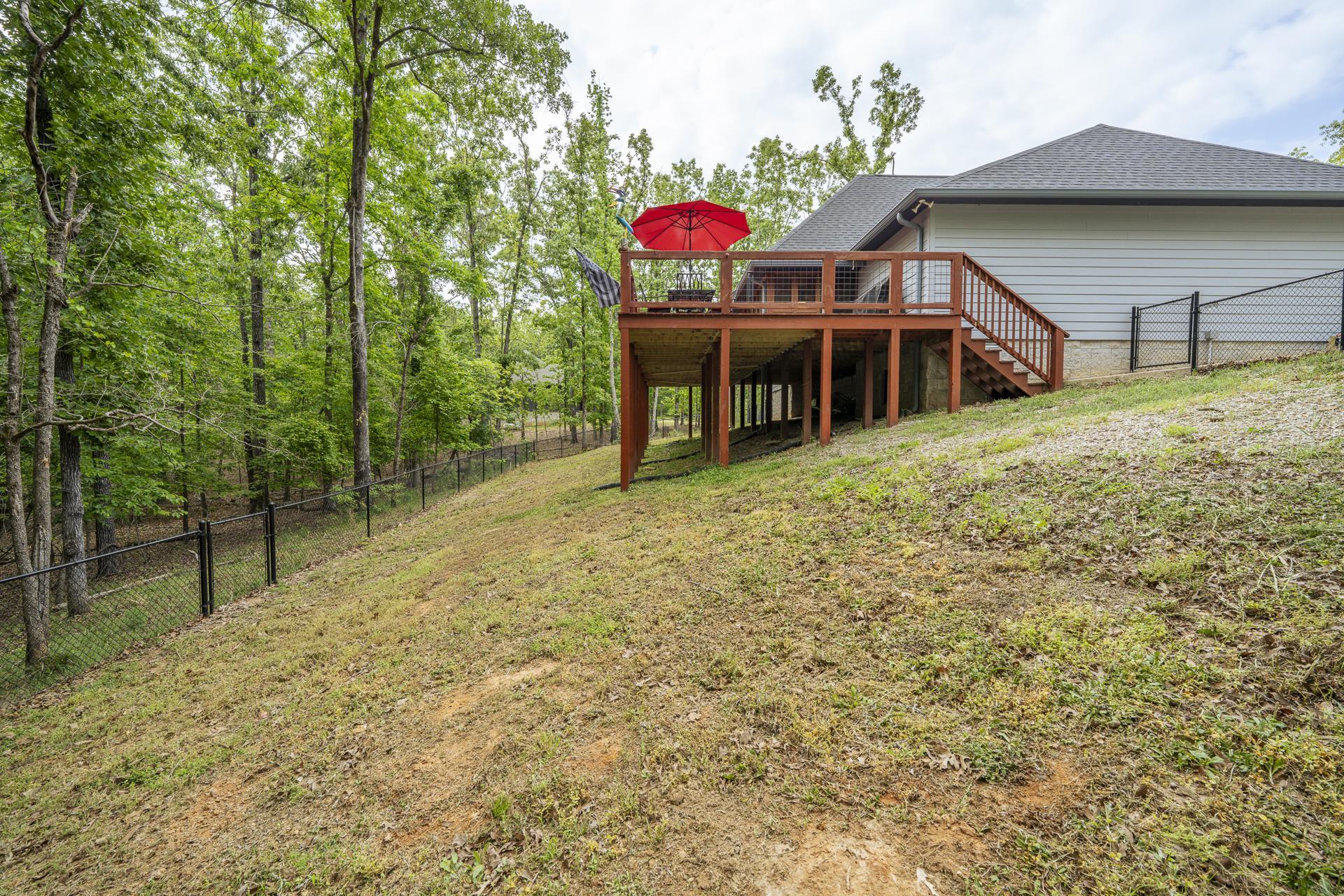 315 Timber Ridge Drive Counce, TN 38326 - Photo 27 of 40 a yellow house with trees in front of it