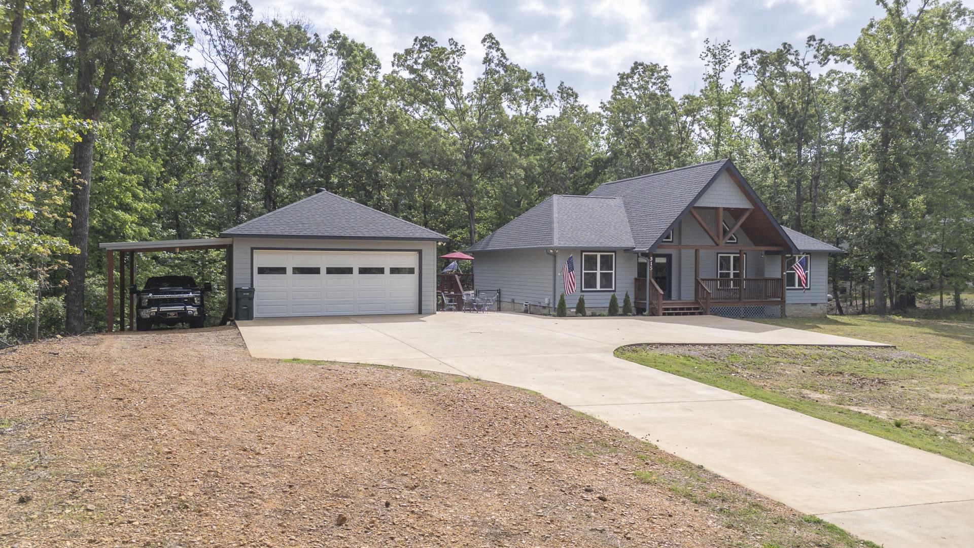 315 Timber Ridge Drive Counce, TN 38326 - Photo 40 of 40 a front view of a house with a yard and trees