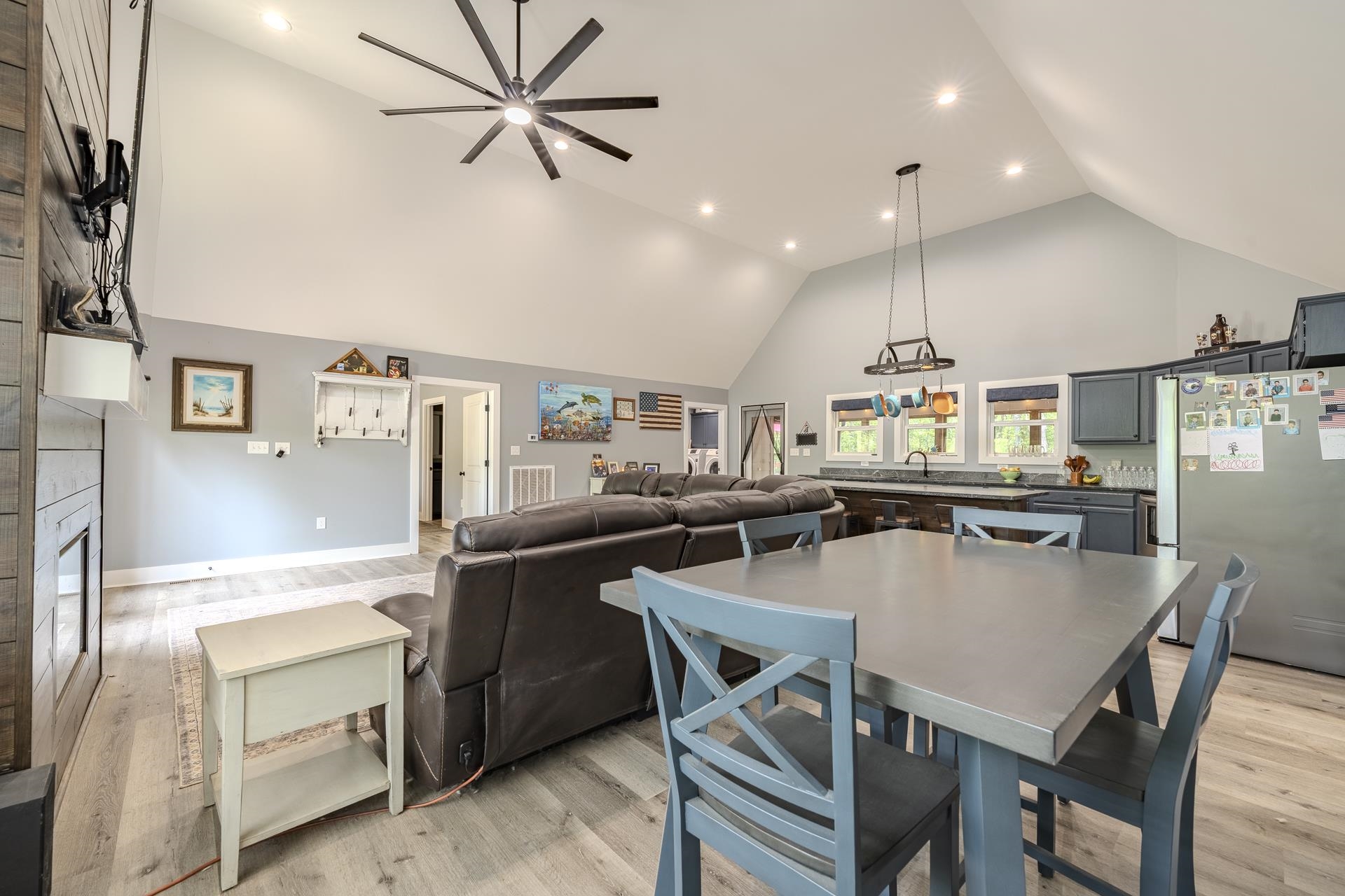 315 Timber Ridge Drive Counce, TN 38326 - Photo 4 of 40 a kitchen with a table chairs refrigerator and microwave