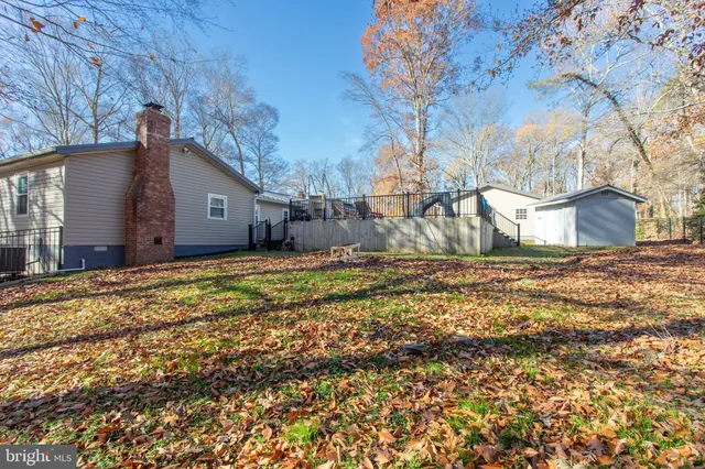 a kitchen with stainless steel appliances granite countertop a stove and a microwave