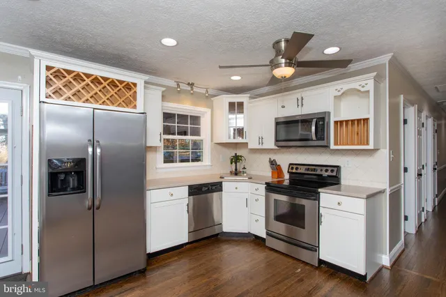a living room with a couch and a window
