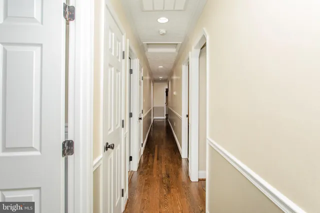 a bathroom with a sink mirror and a shower