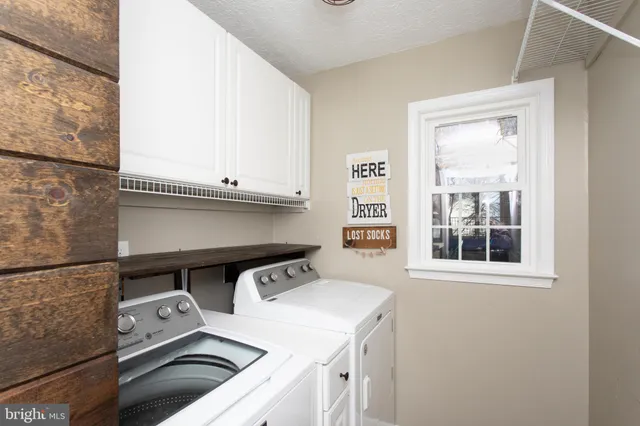 a bedroom with a bed and a fireplace