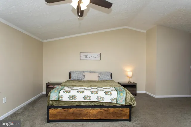 a bedroom with furniture and a chandelier