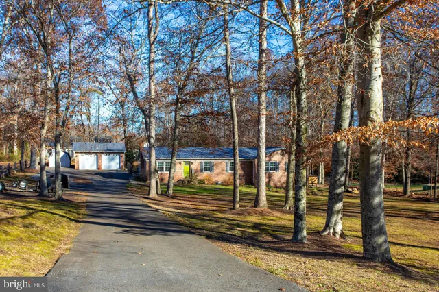 a view of a swimming pool with an outdoor seating