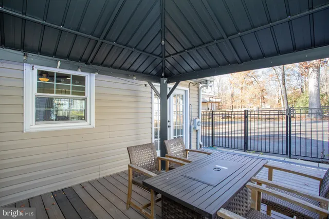 a kitchen view with table and chairs