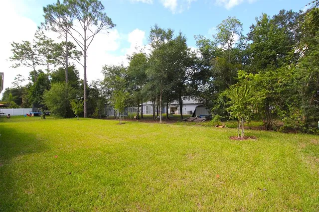 a view of a swimming pool with an outdoor space and seating area