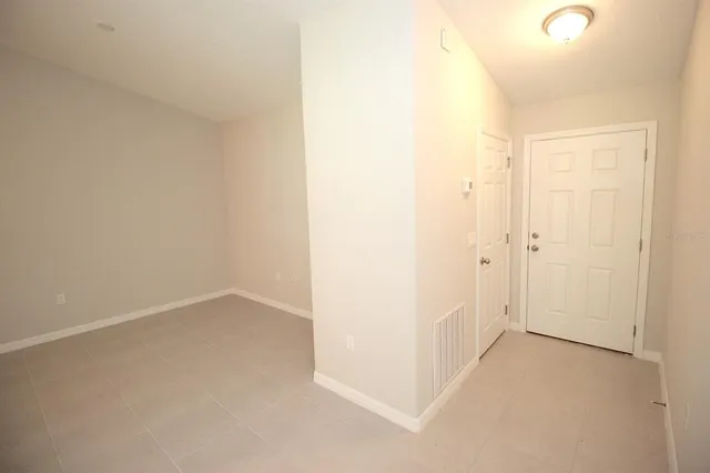 an empty room with a hallway