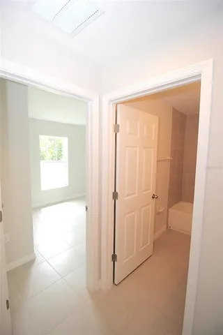 a bathroom with a granite countertop sink a toilet and a bathtub