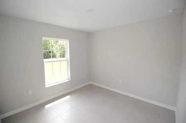 a view of room that has a wooden floor