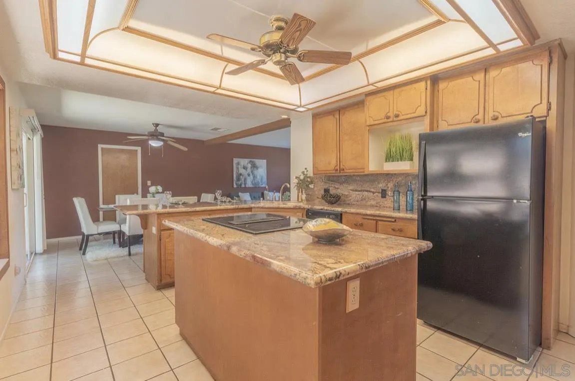 2328 Grace Lane Alpine, CA 91901 - Photo 13 of 27 a kitchen with stainless steel appliances granite countertop a sink and a refrigerator