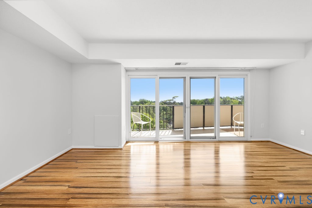 2956 Hathaway Road, Unit U704 Richmond, VA 23225 - Photo 18 of 42 Room featuring a three-panel sliding glass door, a