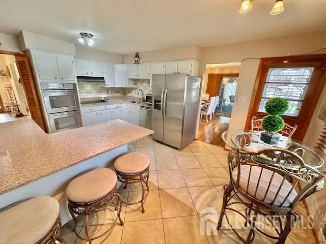 a view of a bathroom with shower and closet