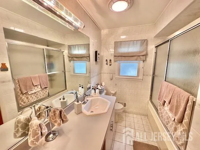 a bedroom with furniture and wooden floor