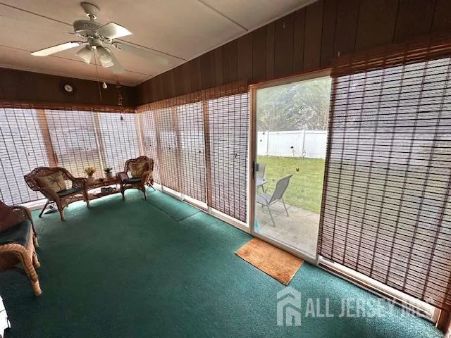 a kitchen with stainless steel appliances granite countertop a refrigerator sink and wooden cabinets