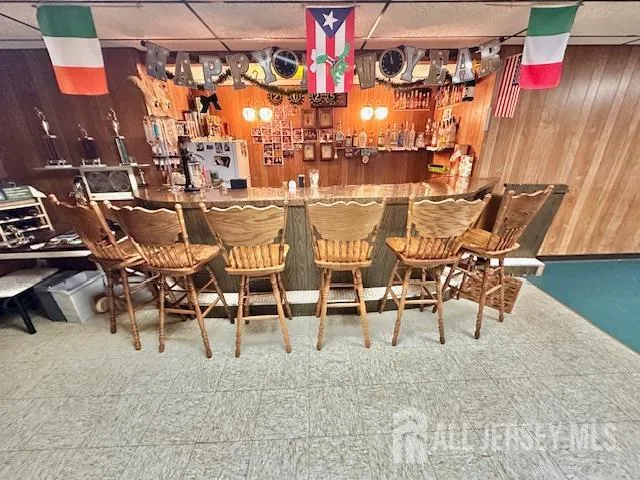a view of a livingroom with furniture a couch and wooden floor