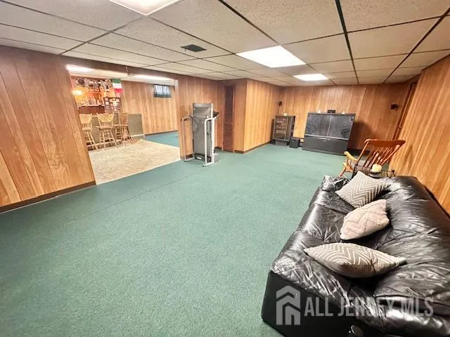 a house view with a sitting space and garden