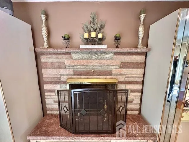 a view of granite countertop chair and fireplace