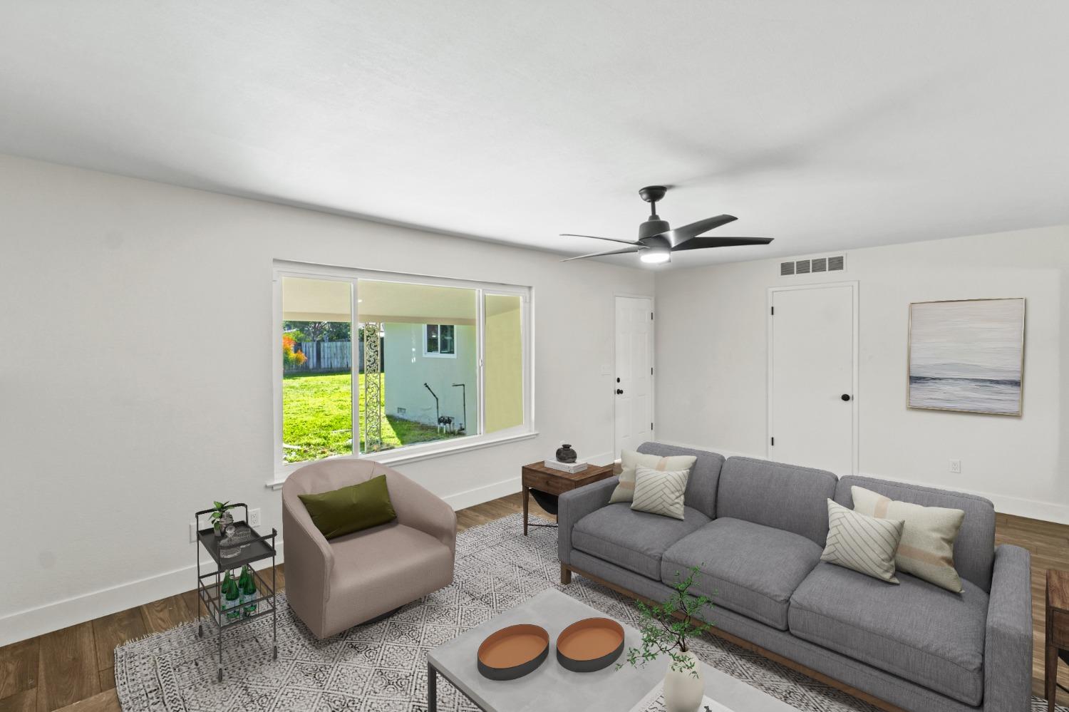 725 West Rialto Avenue Fresno, CA 93705 - Photo 12 of 25 a living room with furniture and a window