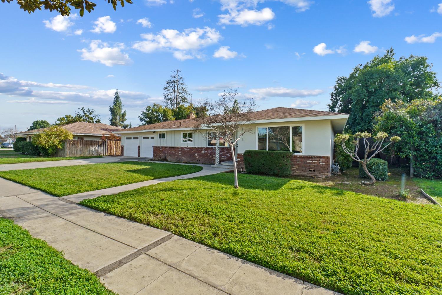 725 West Rialto Avenue Fresno, CA 93705 - Photo 2 of 25 a view of a house with a yard