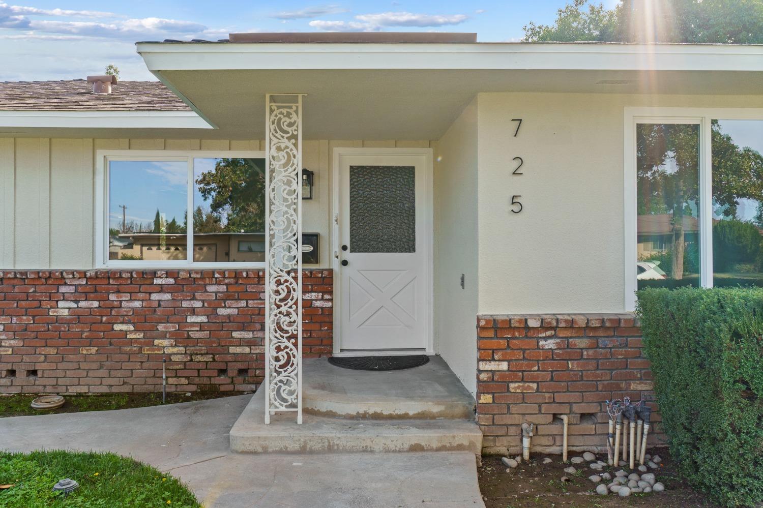 725 West Rialto Avenue Fresno, CA 93705 - Photo 3 of 25 a front view of a house with a porch