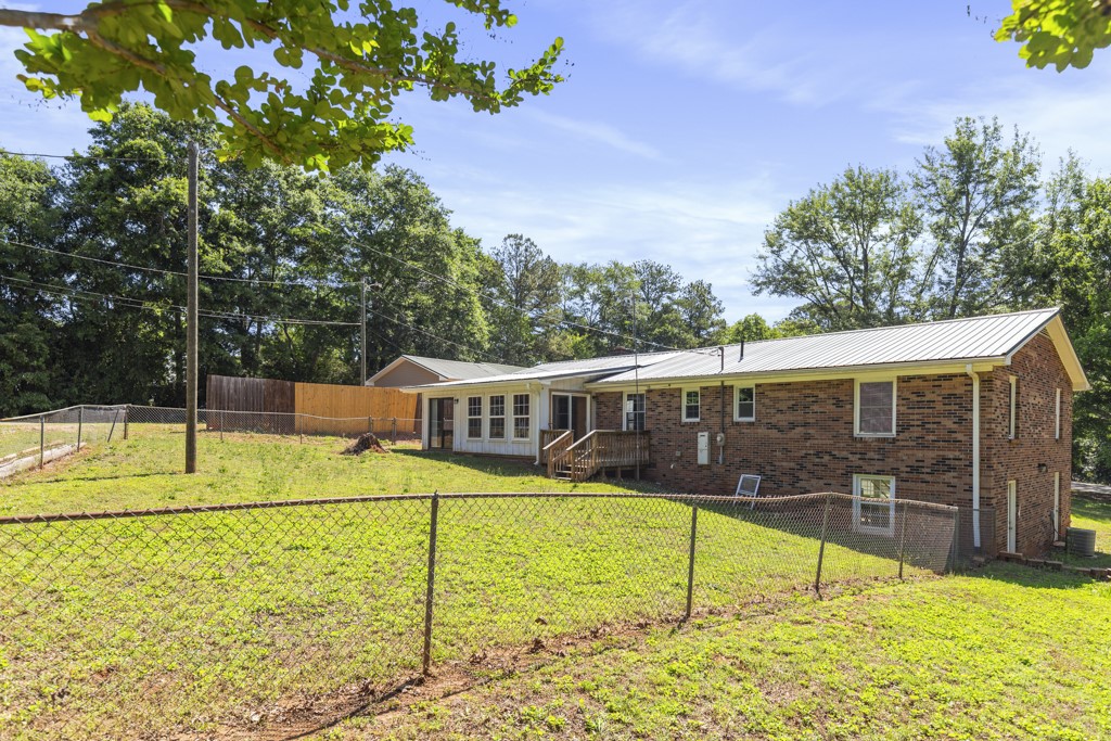 104 Doyle Drive Seneca, SC 29678 - Photo 18 of 19 This residence features a fenced yard, an inviting deck, and durable brick construction.