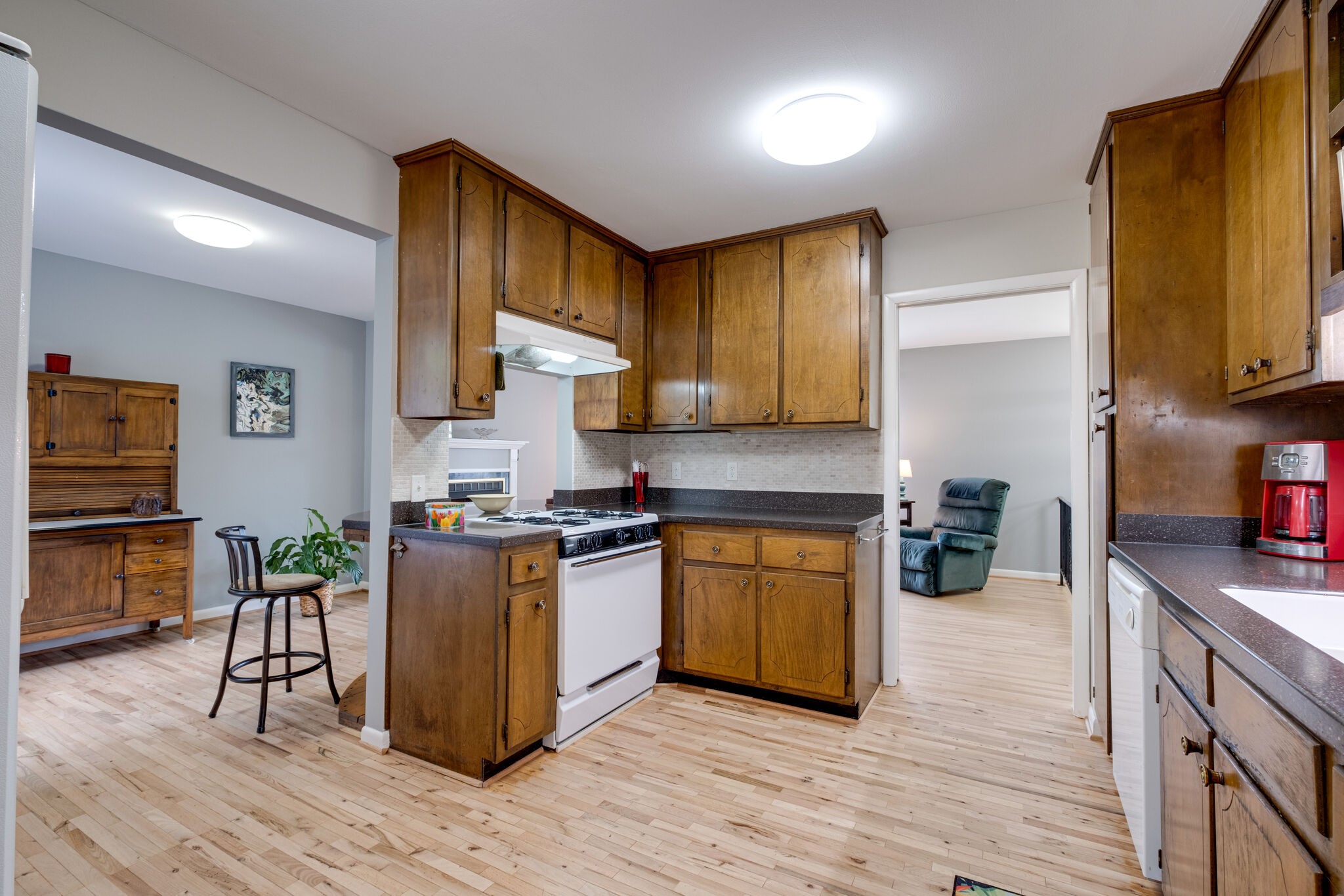 3021 Anderson Road Nashville, TN 37217 - Photo 11 of 27 a kitchen with stainless steel appliances granite countertop sink stove top oven and cabinets