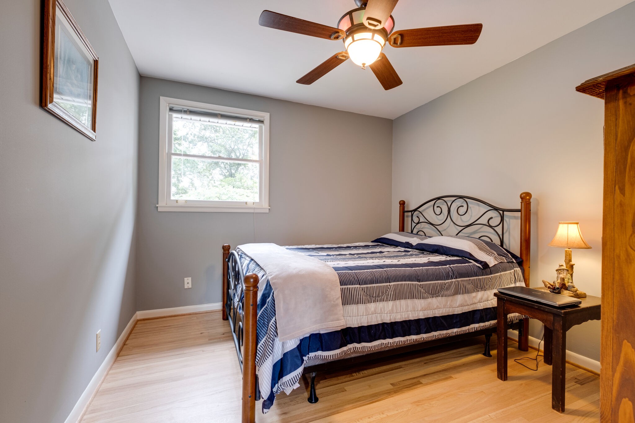 3021 Anderson Road Nashville, TN 37217 - Photo 12 of 27 a bedroom with a bed and a chandelier