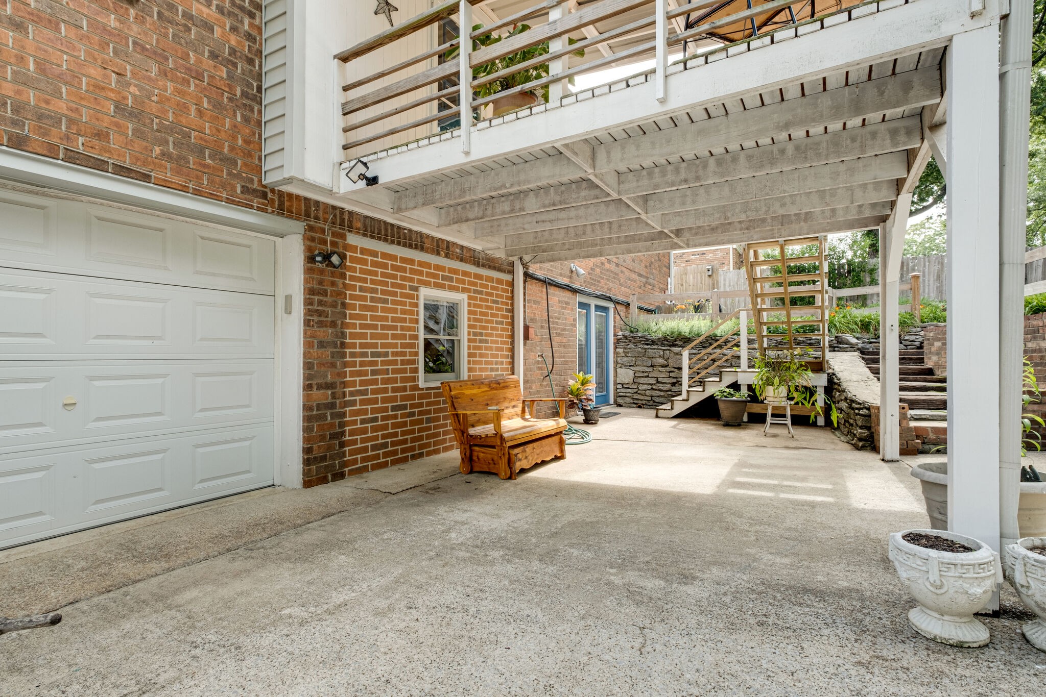 3021 Anderson Road Nashville, TN 37217 - Photo 25 of 27 a view of a patio with table and chairs and potted plants