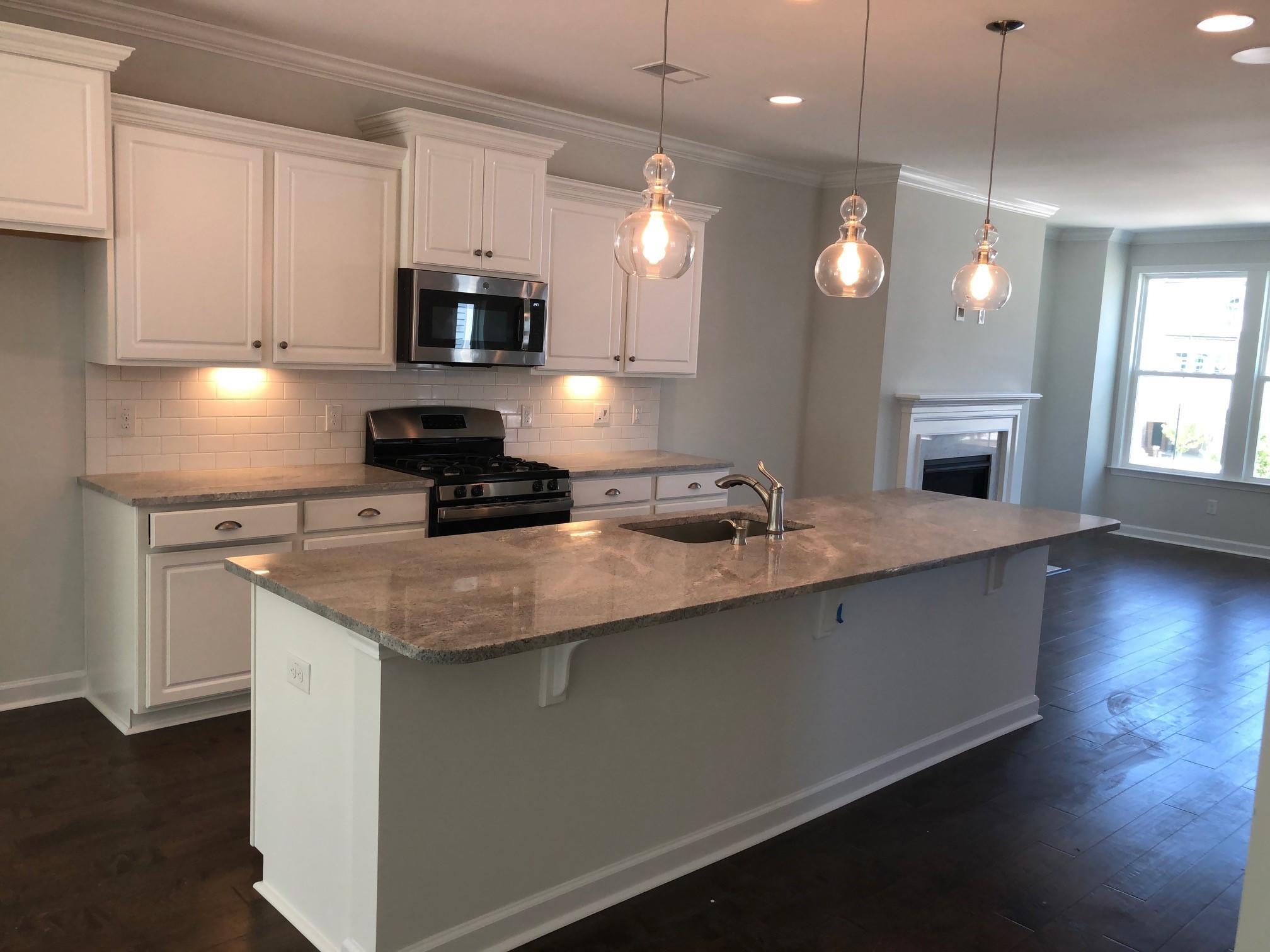 1554 Moss Spring Road Mount Pleasant, SC 29466 - Photo 3 of 12 Kitchen island and pendant lights