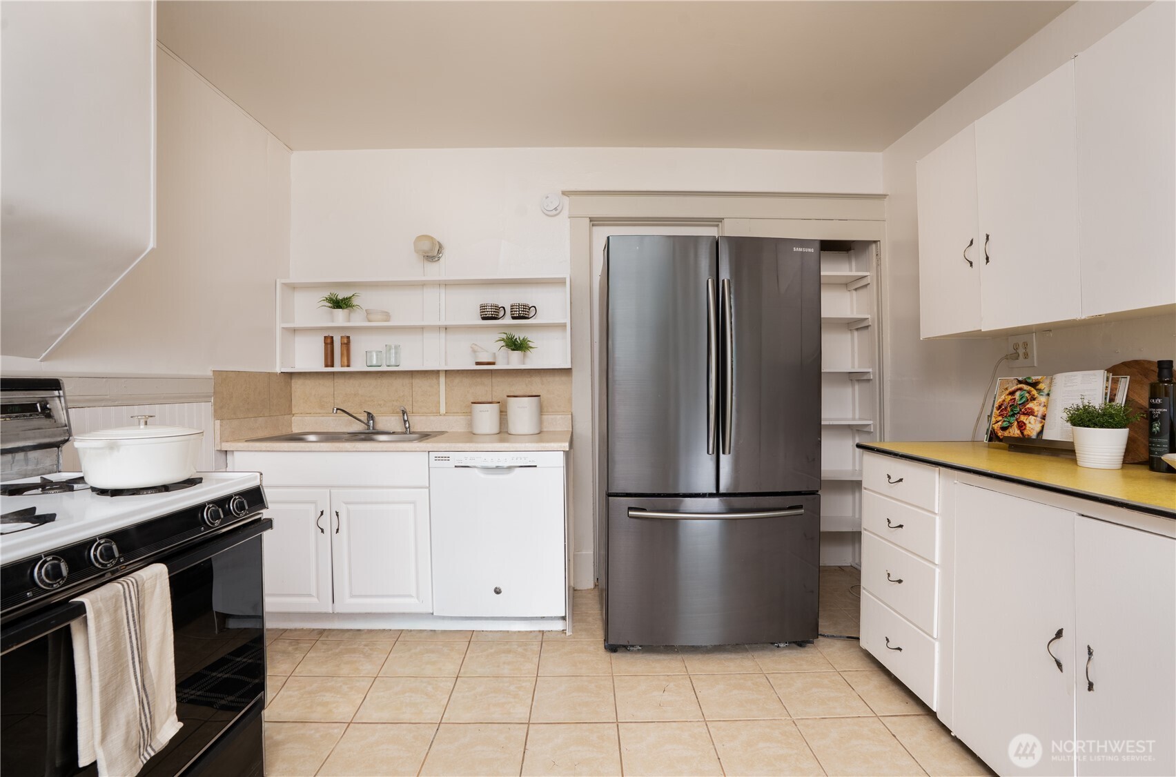 205 Brandywine Avenue DuPont, WA 98327 - Photo 14 of 38 a kitchen with stainless steel appliances granite countertop a refrigerator sink and stove