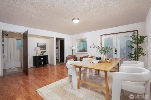 a view of a dining room with furniture and wooden floor