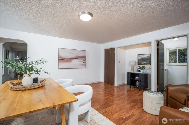 a view of a dining room with furniture window and wooden floor