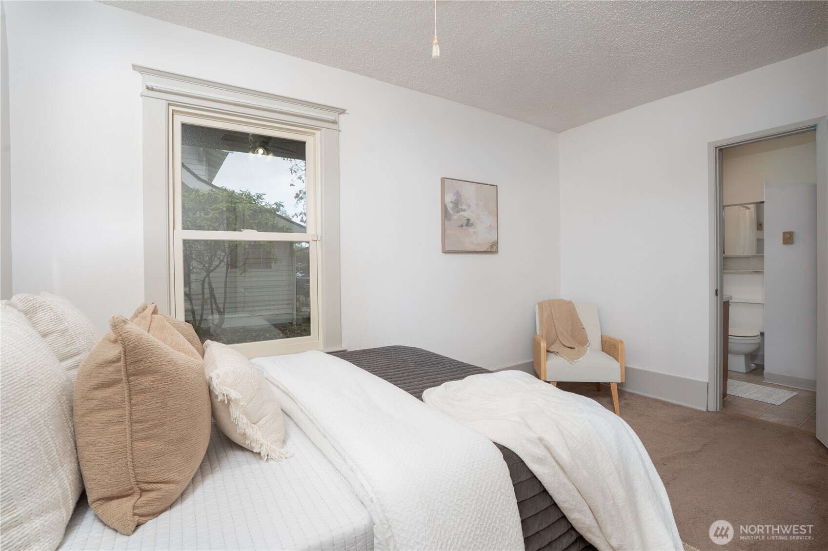 205 Brandywine Avenue DuPont, WA 98327 - Photo 22 of 38 a bedroom with a bed and a mirror