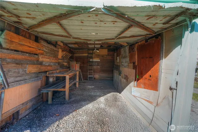 a view of a room with wooden walls