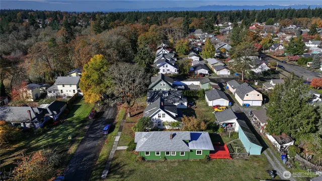 an aerial view of house with yard swimming pool and outdoor seating
