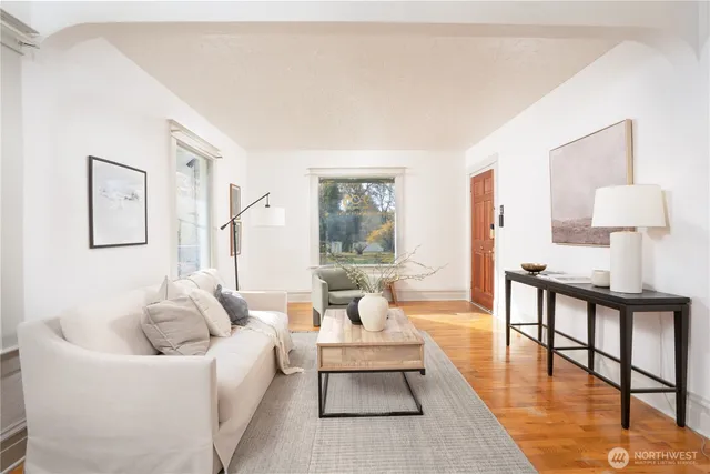 a living room with furniture and a table