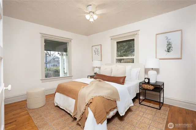 a bedroom with a bed and a window