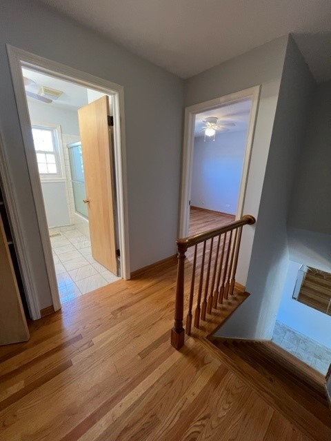 2156 Rugen Road, Unit D Glenview, IL 60026 - Photo 14 of 15 a view of a hallway with wooden floor and staircase