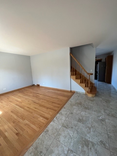 2156 Rugen Road, Unit D Glenview, IL 60026 - Photo 2 of 15 a view of an empty room with stairs