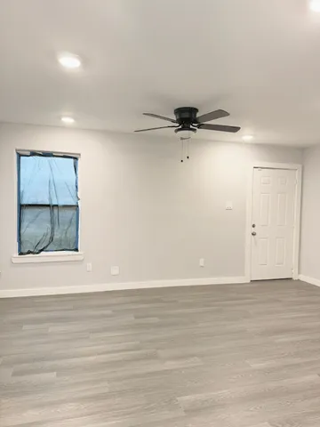 a view of kitchen with wooden floor