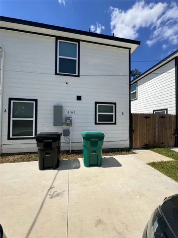 a view of a patio with two couches and a fireplace