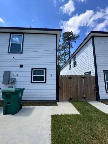 a brick building with a yard