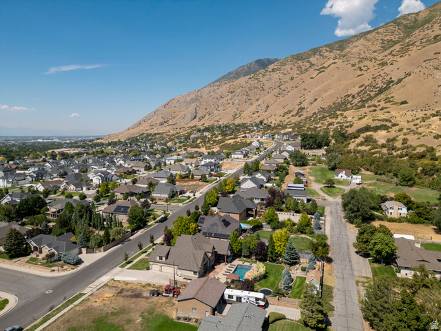687 South 2080th Street East Springville, UT 84663 - Photo 86 of 149 Aerial perspective of a developed residential neighborhood with a backdrop of natural mountainous terrain