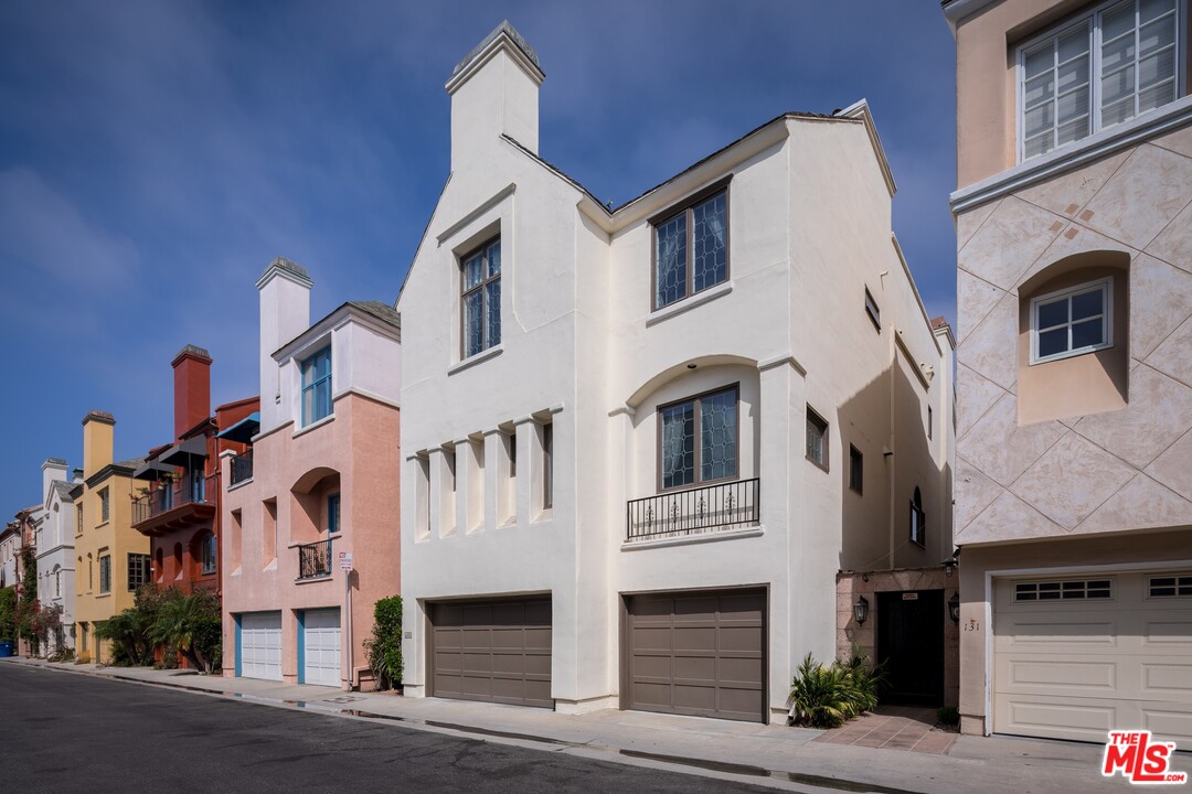 a front view of residential houses with stairs