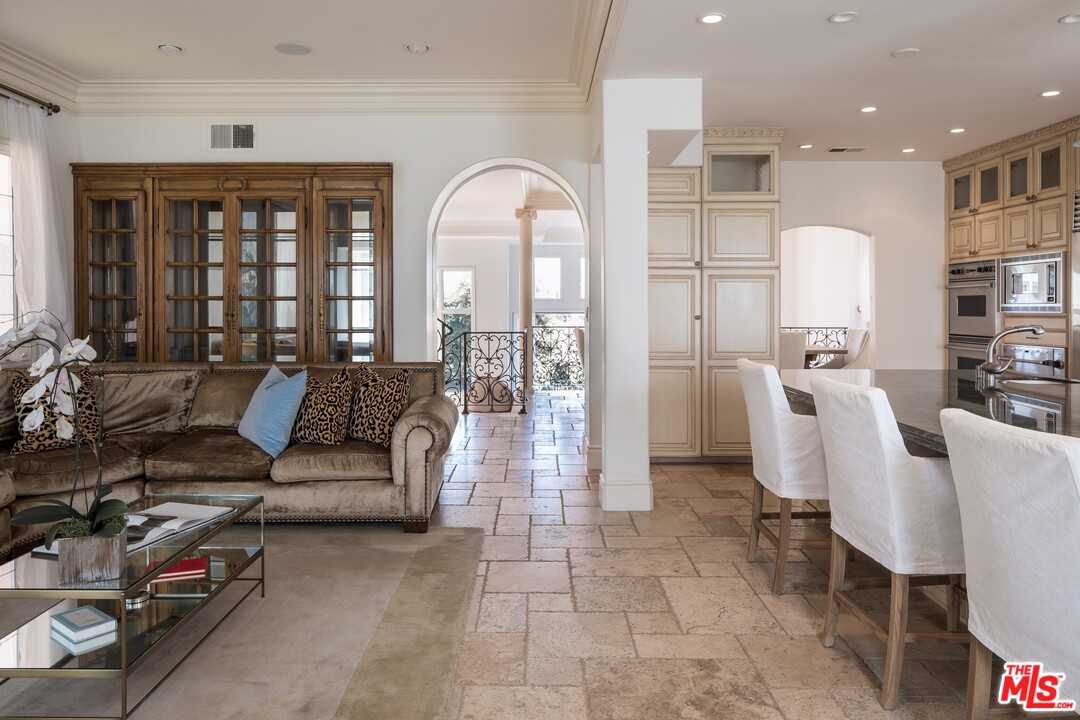 129 Roma Court Marina del Rey, CA 90292 - Photo 16 of 42 a living room with furniture and large windows