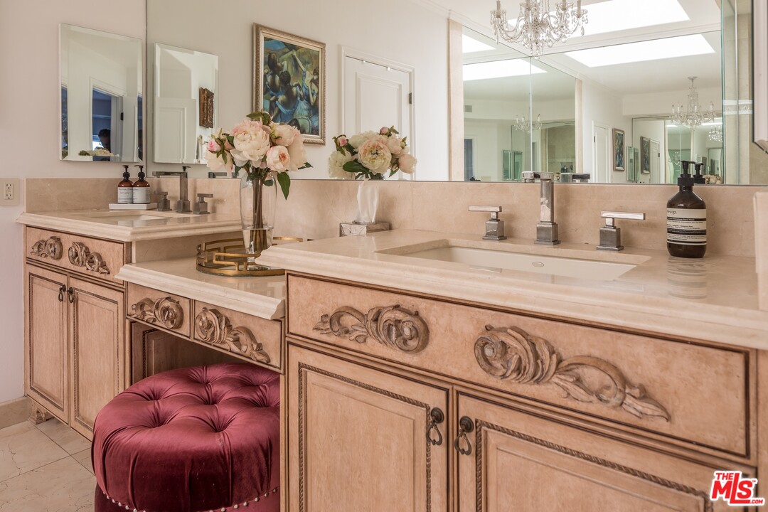 129 Roma Court Marina del Rey, CA 90292 - Photo 25 of 42 a bathroom with a sink and a mirror